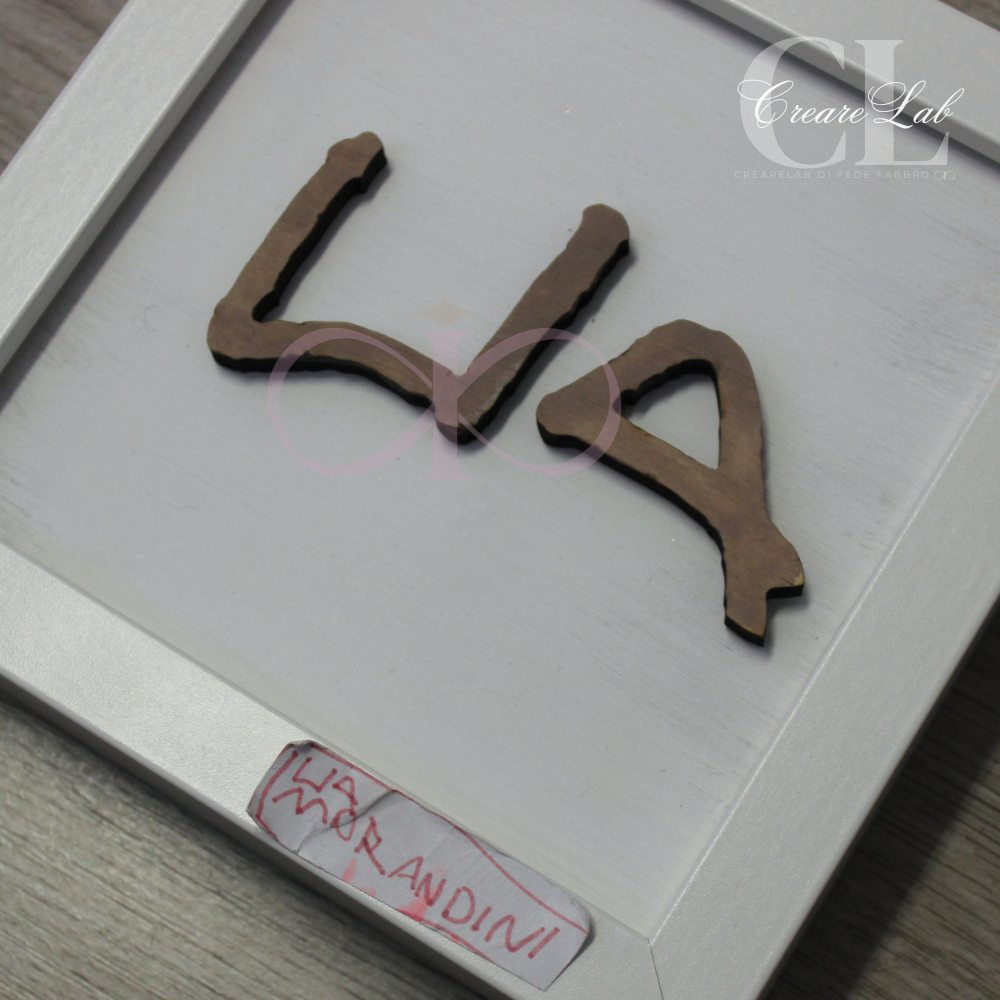 Cornice in legno Nome